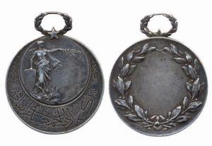 Islamic Medal, Silver, goddess standing to right on obv with Arabic legend beneath; wreath