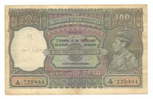 George VI, Rupees 100, 1938, signed J. B. Taylor, Madras, (Jhun #7.1F). Slight stain on ed