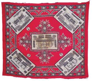 A red decorative cloth of 24 inches by 28 inches, on it a print of rare Uniface banknotes 