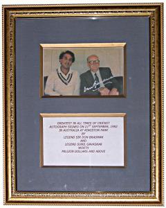 Autograph of two Great Cricketers, Sir Don Bradman and Sunil Gavaskar on a picture, sittin