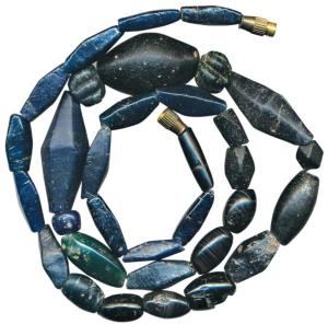 Ancient Beads, (c.100-1,000 BC), used for jewellery. A newly strung necklace made from bea