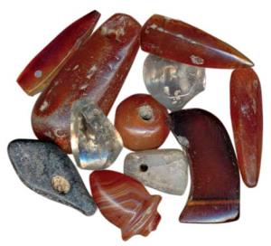 Carved beads of carnelian and quartz, especially used as nose ornaments, in different shap