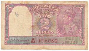 George VI, Rupees 2, 1944, signed C. D. Deshmukh, red serial number, (Jhun 2.3). Fine+.