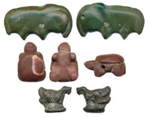 Animal Beads (c. 3rd BC-3rd AD), carved bead of a bull in green stone and a tortoise in br
