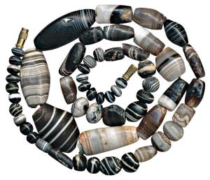 Beads, used for jewellery, a newly strung attractive necklace made from beads of black jas