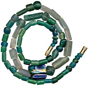 Beads, used for jewellery, a newly strung attractive necklace made from beads of green sto