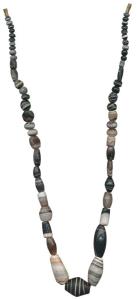 Beads, used for jewellery, a newly strung attractive necklace made from beads of black jas