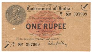 George V, Rupee 1, 1st issue, 1917, signed M. M. S. Gubbay, (J&R 1.1A). Torn at the bottom