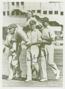 Autograph of Don Bradman on Post Card, his team mates carrying him after he scored 452 not
