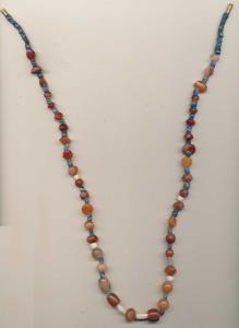 Ancient Beads, probably used for jewellery, a newly strung necklace made from beads of car