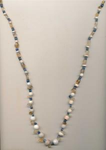 Ancient Beads, probably used for jewellery, a newly strung necklace made from beads of top