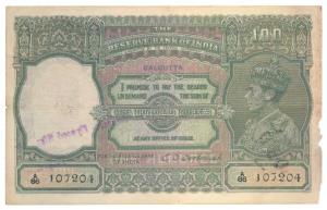 George VI, Rupees 100, 1944, Calcutta, signed C. D. Deshmukh (J&R 7.2D). Edges frayed, Fin