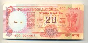 Rupees 20 bundle, signed K. R. Puri, (IPM E-5). The top note slightly stained and slight r