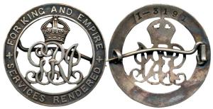 Silver War Badge, a broach mounted circular badge with the crowned royal monogram in the c