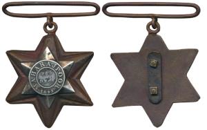 Gwalior Star, six pointed copper medal, Maharajpoor 29th December 1843 in center on a star
