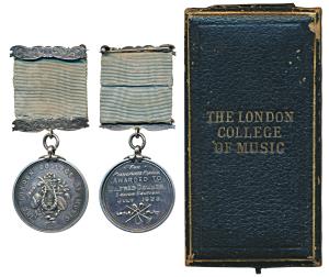 The London College of Music, Silver Medal, obv. arms of the college made up of musical ins