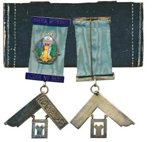 Masonic Medal, Universal Brotherhood, Silver and Enamel, a native shaking hands with an En
