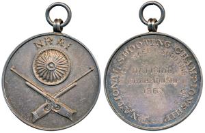 National Rifle Association of India, obv.Ashoka chakra above two crossed rifles, rev. Clay