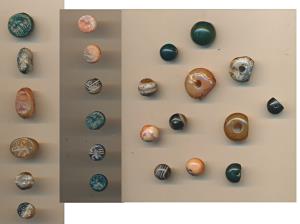 Modern, an assorted lot of Beads, all etched with different figurines in negative, of diff