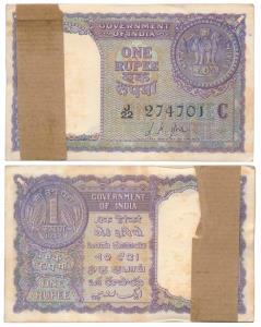 Rupee 1 Bundle, 1957, signed L. K. Jha, (J&R 6.1.4.3B). Slight graffiti at top and bottom,