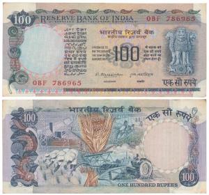 Rupees 100, signed M. Narsimham, fancy number 786965. Slightly stained borders, About Extr