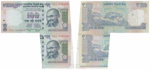 Rupees 100, signed Raghuram Rajan, Error, the top note attached to the bottom due to paper