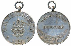 Primary Program Exhibition, Silver Medal, obv. P. P. Exhibition, with Ganeshji seated on a