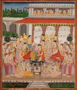 A young Rama and Sita seated at the centre of their Panigrahan Sanskar on the terrace of a