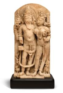 The bearded four-headed deity holding his ladle in his upper right hand, and a manuscript 