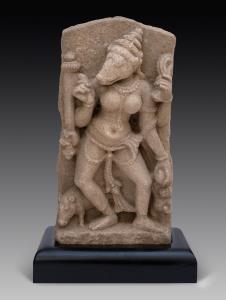 The boar-headed yogini with four arms, standing in dancing pose,holding an attribute in ea