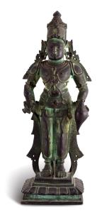 Standing erect on a rectangular brick in characteristic pose with his hands at his hips, a