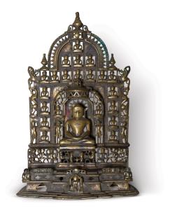 Of open work arched form, with central tirthankara seated on a lion throne within a niche,