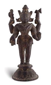 The four-armed Hindu god standing on a flared circular lotus base, his primary hands in ab