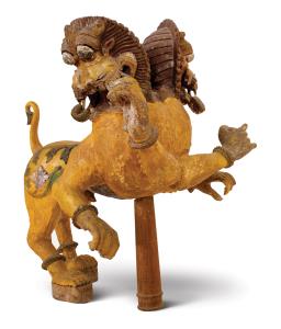 With twin heads and upper bodies, in rearing pose, with bulging eyes, gaping jaws and flar