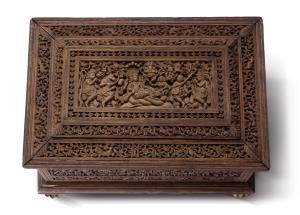 Of rectangular form, on claw feet, the exterior profusely carved with figures of Vaishnavi