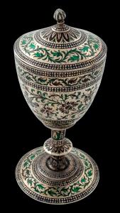 Of conical form, the ringed cylindrical stem with flared circular foot, the lid with a bud