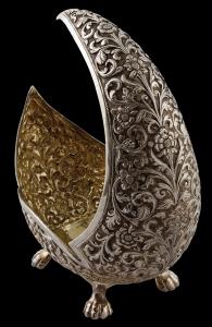 In the form of a crescent, the high chased vessel, the high chased vessel decorated with c