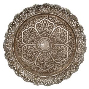 Resting on three volute-shaped feet, the rim pierced and decorated with openwork floral te