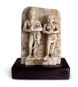 This couple, with their hands in the traditional pose of humble devotion and the woman wit