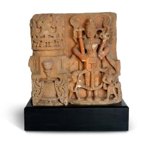 Carved in relief, depicting the yaksha couple Padmavati and Dharanendra respectively, each