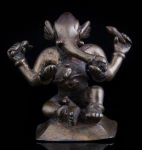 The four-armed elephant headed deity seated on a flared square base, his vahana, the mouse