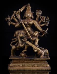 The eight-armed goddess on rectangular base, decorated with petals, wielding various weapo