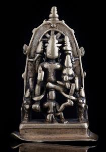 The God seated in lalitasana on his vahana, his consort Lakshmi on his left knee, the grou