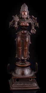 Standing on a raised square lotus base, the four armed goddess holding drum, trident, noos