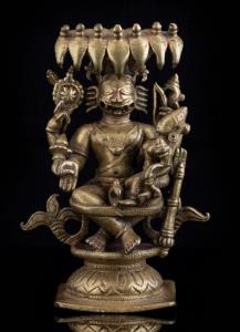 The four armed, lion headed avatar of Vishnu seated on a lotus, his consort Lakshmi on his