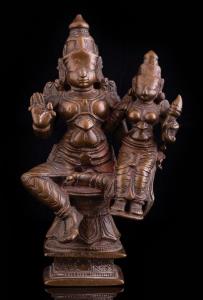 Lord Rama seated in lalitasana on a lotus, his right hand in abhaya mudra, his wife Sita o