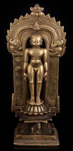 The sky-clad male figure standing on a raised lotus base, his bull emblem at the front, su