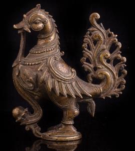 Of stylised form, standing on circular base, holding the stem of a padma in his beak, with