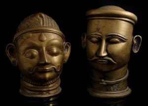 Each of columnar form with moustachioed face of Shiva, each with headband, one with long p