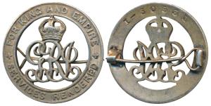 Silver War Badge, a broach mounted circular badge with the crowned royal monogram in the c